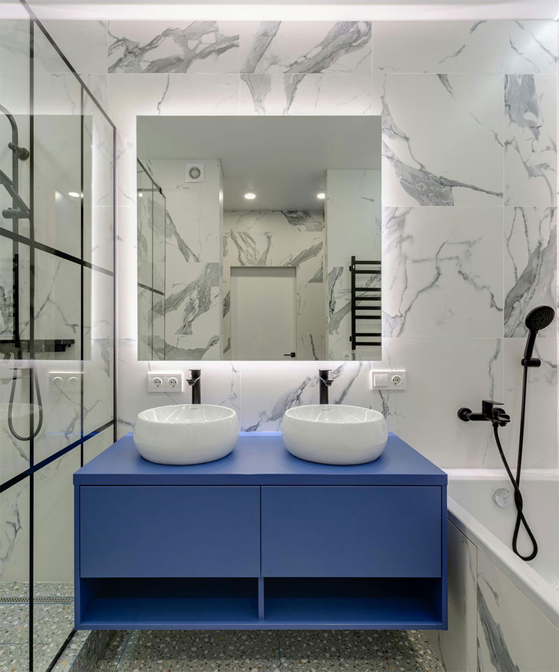 Bathroom remodel with a modern shower, sink and tub
